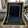 Tapis de luxe en peau de mouton véritable noire avec des accents dorés - Tapis élégant de style Versace, fait à la main - Idéal pour le salon et la chambre à coucher